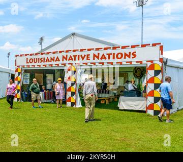 NEW ORLEANS, LA, USA - APRIL 29, 2022: Louisiana Native Nations tent and crowd of people at the 2022 New Orleans Jazz and Heritage Festival Stock Photo
