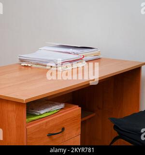 A stack of papers on a desktop without a computer Stock Photo