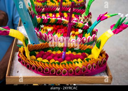 Colorful art handmade krathong or floating lantern basket craft for thai people select buy and into float at river forgiveness from the Goddess of wat Stock Photo
