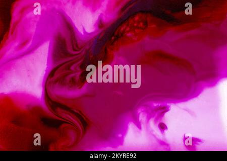 Bright flowing alcohol Ink on toning in Viva Magenta background. Acrylic Fluid Art. Liquid marble texture for abstract artwork. Trendy creative design in color of 2023. High quality photo Stock Photo