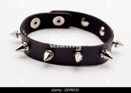 a full stud bracelet with black leather on a white background Stock Photo