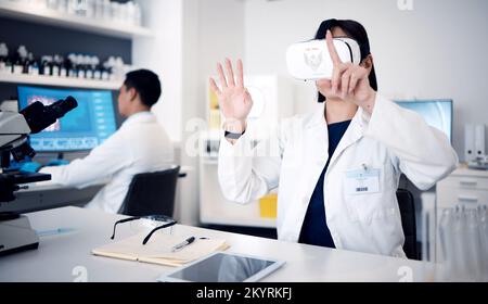 Virtual reality, glasses and science with scientist woman in 3d metaverse, software innovation and biotechnology research in laboratory. VR, ai and Stock Photo