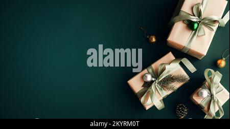 Banner with many gift boxes with paper decorations on turquoise background. Christmas background. Stock Photo