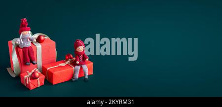 Banner with many gift boxes with paper decorations on turquoise background. Christmas background. Stock Photo