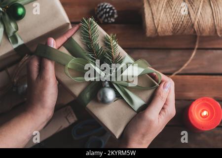 Flat lay composition with Christmas gift boxes and decor on wooden table Stock Photo