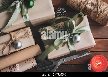Flat lay composition with Christmas gift boxes and decor on wooden table Stock Photo