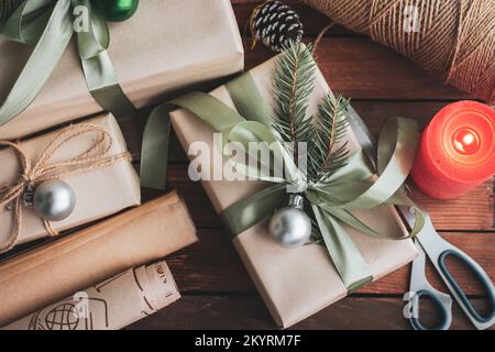 Flat lay composition with Christmas gift boxes and decor on wooden table Stock Photo