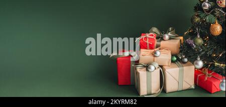 Banner with many gift boxes with paper decorations on turquoise background. Christmas background. Stock Photo