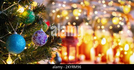 Decorated Christmas tree on blurred background. New year background. Stock Photo