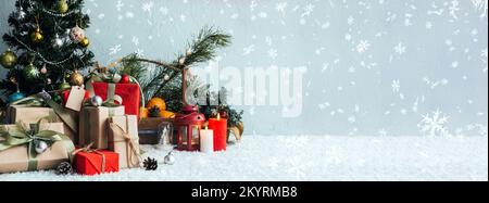 Banner with many gift boxes with paper decorations on turquoise background. Christmas background. Stock Photo