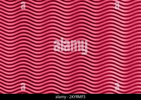 Abstract wavy purple background. Demonstrating the colors of 2023 - Viva Magenta. Stock Photo