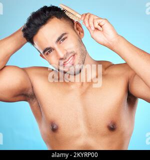 Beauty, hair and brush with portrait of man for grooming, hygiene or self care routine. Salon, hairstyle and treatment with model for cosmetics Stock Photo