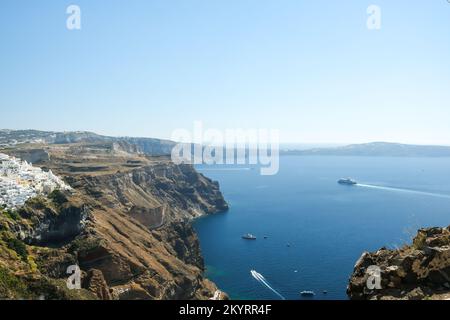 Santorini, Greece - September 16, 2022 : Panoramic view of a ferry boat arriving at Santorini Greece Stock Photo