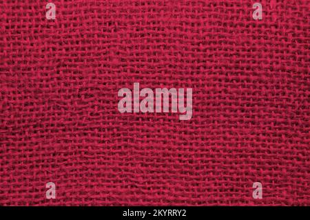 Top view of sackcloth fabric for background. Close-up of viva magenta color sackcloth texture for background. Stock Photo