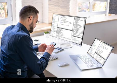 Software Programmer Or Coder Man Using Office Computer Stock Photo