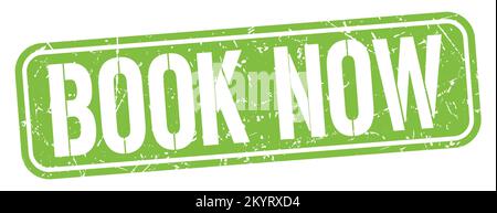 BOOK NOW text written on green grungy stamp sign. Stock Photo