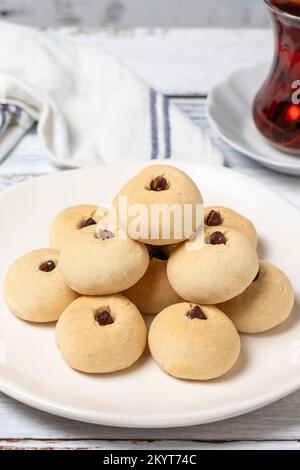 Pistachio cookies. Cookies with flour on wood background. close up Stock Photo