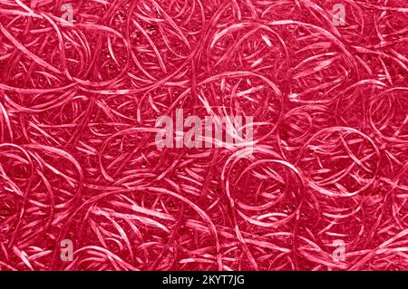 Magenta texture of compressed wood chippings board. Viva magenta color of the year 2023. Top view. Stock Photo