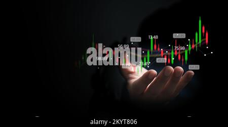 Finance and business investment concept. Stock and crypto investment funds.Businessman analyzing or trading Forex graphs of financial data candlestick Stock Photo