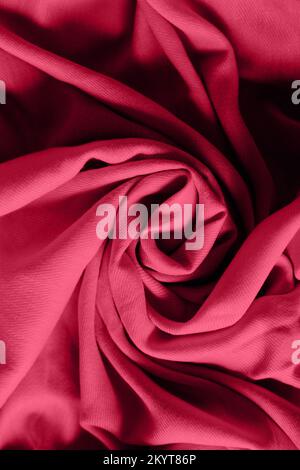 Color of the year 2023. . Viva Magenta color trends. Crumpled fabric background. Abstract background Stock Photo