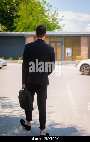 A successful businessman just left the cafeteria Stock Photo