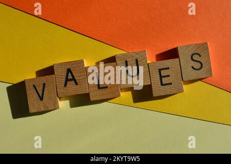 Values, word in wooden alphabet letters isolated on bright yellow ...