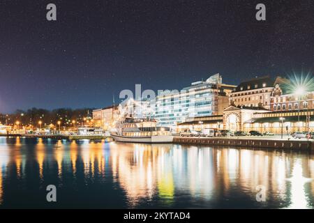 Helsinki, Finland. Bright Blue Starry Sky. Night View Of Etelaranta Street. Vanha Kauppahalli, Old Market Hall. Dark Blue Dramatic Sky With Shining Stock Photo