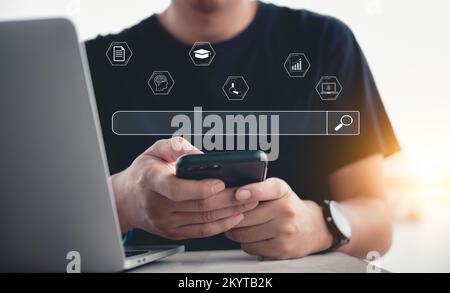 Online education man using mobil smart phone and laptop computer search browser digital technology network cyberspace icon virtual.innovation developm Stock Photo