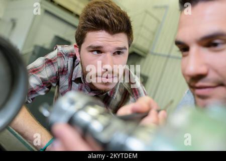 two engineers working in workshop Stock Photo