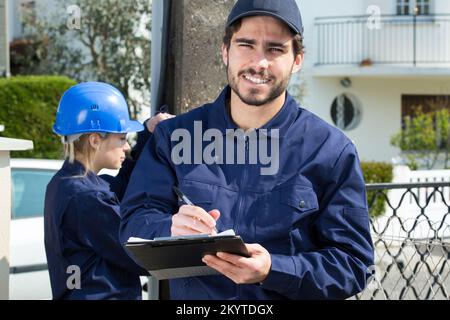 portrait of electrician workers outdoors Stock Photo