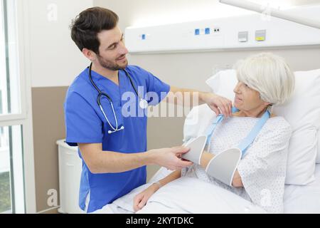 male doctor taking care senior woman Stock Photo