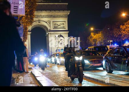 Paris, France, 01/12/2022. Moroccan and Tunisian supporters celebrate Morocco's qualification for the FIFA World Cup in Qatar, on the Champs Elysees, in Paris. Pierre Galan/Alamy Live News Stock Photo