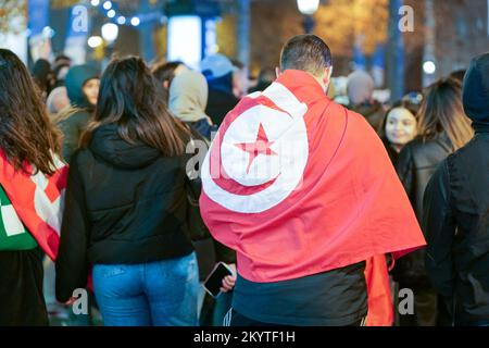 Paris, France, 01/12/2022. Moroccan and Tunisian supporters celebrate Morocco's qualification for the FIFA World Cup in Qatar, on the Champs Elysees, in Paris. Pierre Galan/Alamy Live News Stock Photo