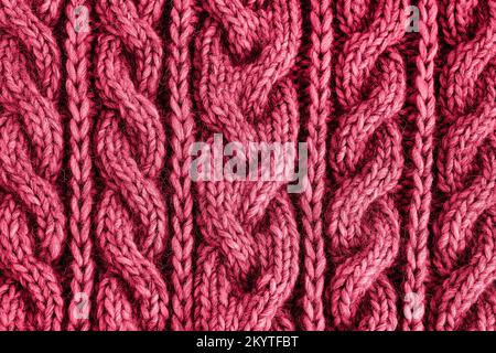 Red viva magenta knitted texture. Handmade Knitwear. Color of the year. 2023 Stock Photo