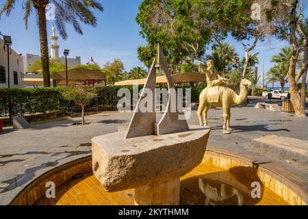 Statue to TE Lawrence (Lawrence of Arabia) and the Minarets of Sharif Hussein bin Ali Mosque in Aqaba Jordan Stock Photo