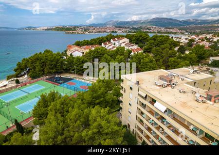 The aerial view on Podstrana village in Croatia. Mountains and Adriatic sea coast. Tennis courts and Residence apartments in Podstrana. Stock Photo