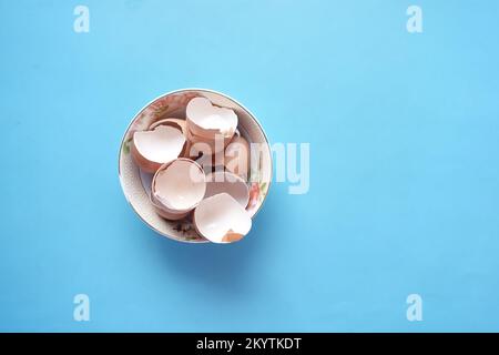 eggshells in a white color bowl on table  Stock Photo