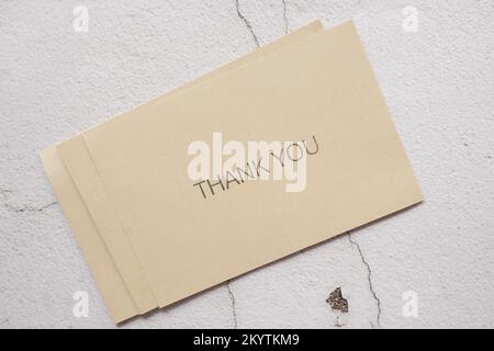 thank you message on a card on table  Stock Photo