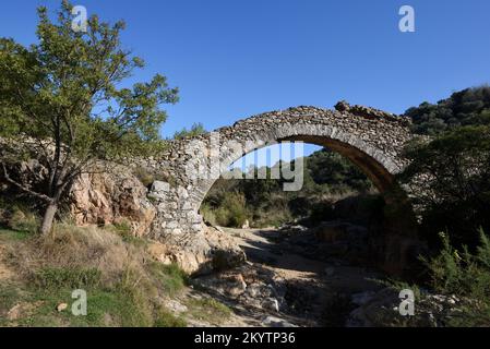 Old Stone Bridge or Humpback Bridge, Pont des Fées, over the River La Garde, Grimaud Var Provence France Stock Photo