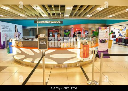SINGAPORE - NOVEMBER 09, 2015: staff at Changi airport. Singapore Changi Airport, is the primary civilian airport for Singapore, and one of the larges Stock Photo