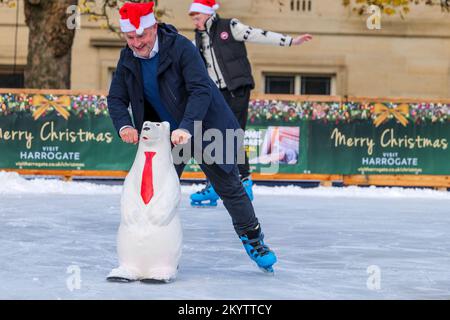 Harrogate Ice Skating rink with ice skaters and people enjoying the winter event and Christmas attraction. Stock Photo