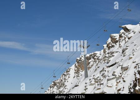 Old chairlift built on a rock on Hintertux Glacier Stock Photo