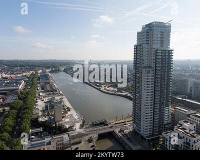 Brussels, Belgium - May 12, 2022: Urban landscape of the city of Brussels, skyscraper apartment building with the river Senne crossing Brussels and in Stock Photo