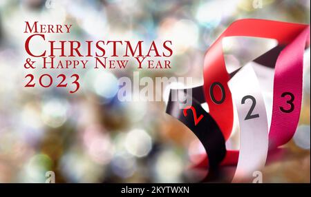 Overlapping Circles and Shapes with silk ribbon and happy new year 2023 text Stock Photo