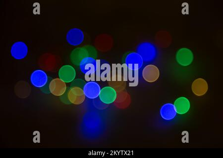 Abstract background, multicolored bokeh on a black background. Stock Photo