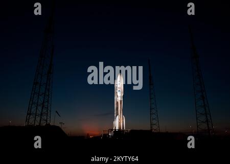 An Atlas V rocket with NASA's Juno spacecraft payload is seen the evening before it's planned launch at Space Launch Complex 41 of the Cape Canaveral Air Force Station in Florida on Thursday, August 4, 2011. The Juno spacecraft will make a five-year, 400-million-mile voyage to Jupiter, orbit the planet, investigate its origin and evolution with eight instruments to probe its internal structure and gravity field, measure water and ammonia in its atmosphere, map its powerful magnetic field and observe its intense auroras.  Photo Credit: (NASA/Bill Ingalls) Stock Photo