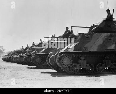 A vintage photo circa March 1943 of a line of American built M3 Grant medium tanks on parade in Australia during World War 2.  These vehicles were provided under the lend lease scheme. Stock Photo