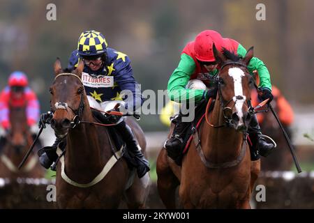 Henri The Second ridden by Harry Cobden (right) passes Henry's Friend ridden by Kielan Woods on their way to winning the Ballymore Winter Novices' Hurdle during day one of The Betfair Tingle Creek Festival at Sandown Park Racecourse, Esher. Picture date: Friday December 2, 2022. Stock Photo