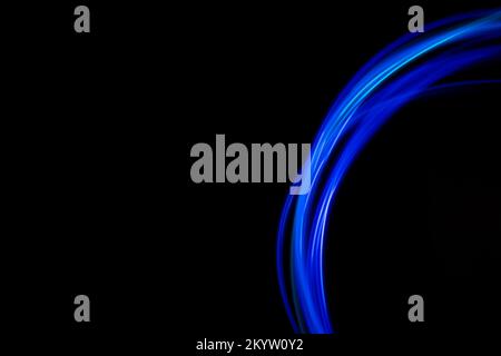 Abstract modern banner design. Glowing neon lines circle on black background. Stock Photo