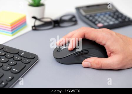 Man using computer mouse. Working at the office Stock Photo